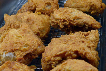 Dave's Crispy Fried Chicken on a cooling rack