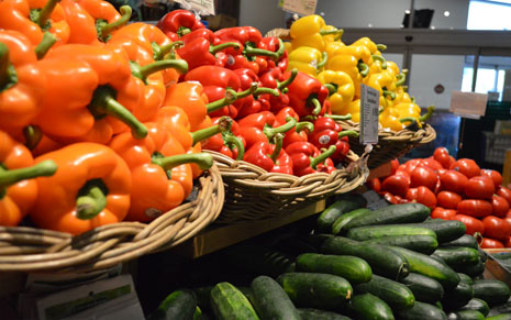 Bell pepper, cucumber and tomato display inside Dave's Fresh Marketplace